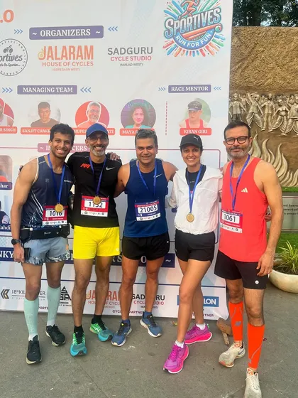 The post-race group photo is always special. Here we are at the Sportives event, a group of friends bonded by the shared experience of the run, celebrating our medals and the effort we all put in.