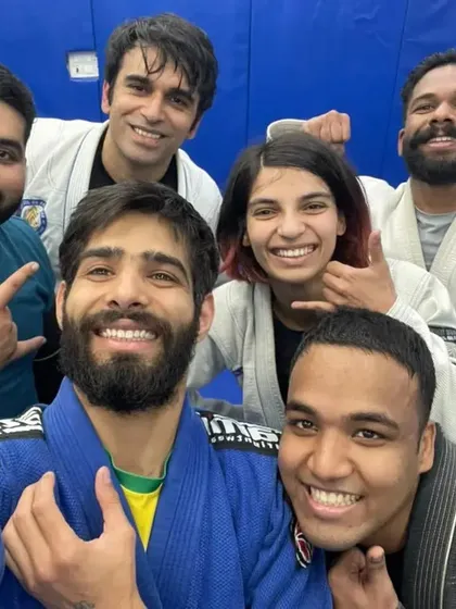 Posing after a tough rolling session. The Gi adds a layer of friction and strategy to every spar.