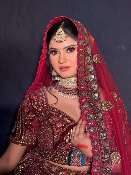 A close-up portrait of the bride. The makeup is kept classic and radiant, enhancing her natural features.