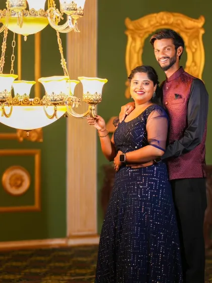 A grand and elegant shot in a room with a large chandelier. This location is perfect for capturing a royal and luxurious feel.