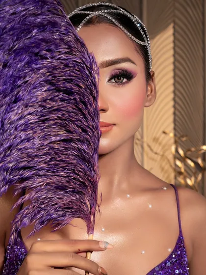 The "Mermaid" look, a stunning purple creation. This close-up shows the beautiful, iridescent makeup and the creative use of props.