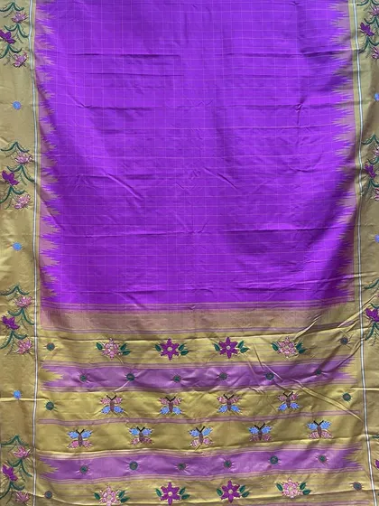 The full view of the custom-embroidered Kanjeevaram silk saree, showing how the Kamal Kadai motifs are placed along the border and pallu. Each element is thoughtfully positioned to create a cohesive and elegant design.
