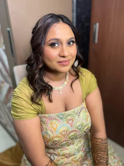 A beautiful Mehendi look with a dramatic smokey eye, perfect for a festive celebration.