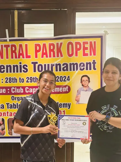 Celebrating a win at the 3rd Central Park Open Table Tennis Tournament. Our player is all smiles with her trophy and certificate, a result of consistent hard work.