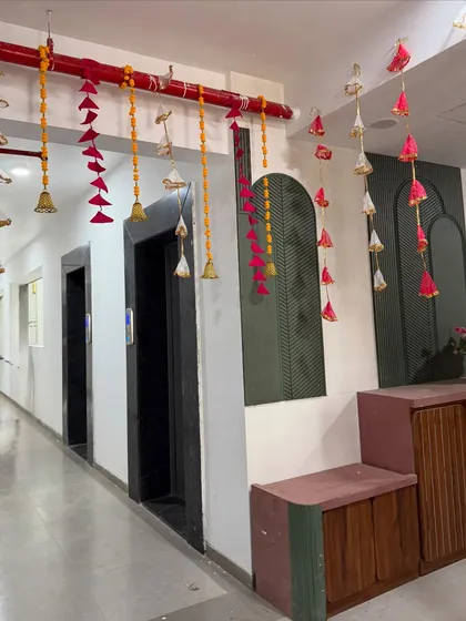 We even decorate the common areas to ensure the festive mood flows throughout the venue. Here, we've used hanging bells and tassels to brighten up a hallway.