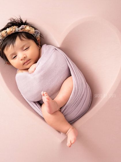 A 40-day-old baby girl in a heart bowl. Even if you miss the typical 5-20 day window, we can still capture beautiful newborn-style portraits.