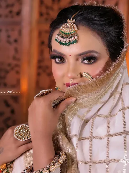 A peek-a-boo shot with the dupatta, creating a sense of mystery and playfulness.