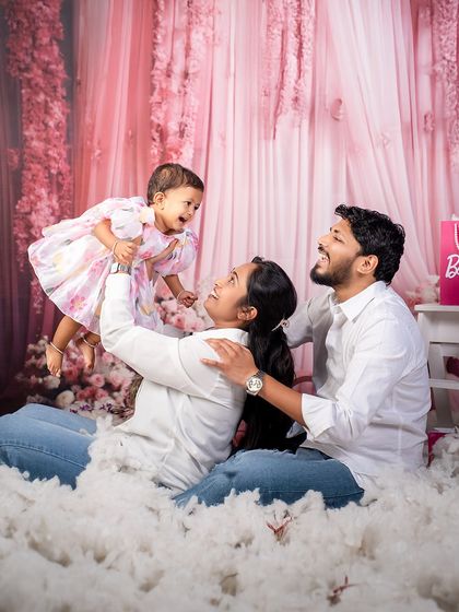 Barbie bags, fluffy clouds, and a family that makes every moment glow. Even in our themed shoots, we always make time for beautiful family portraits.