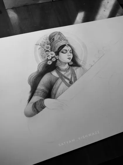 A work-in-progress photo of the Maa Saraswati sketch. This was a special piece I created for Basant Panchami, and this image captures the moment her divine face was complete.