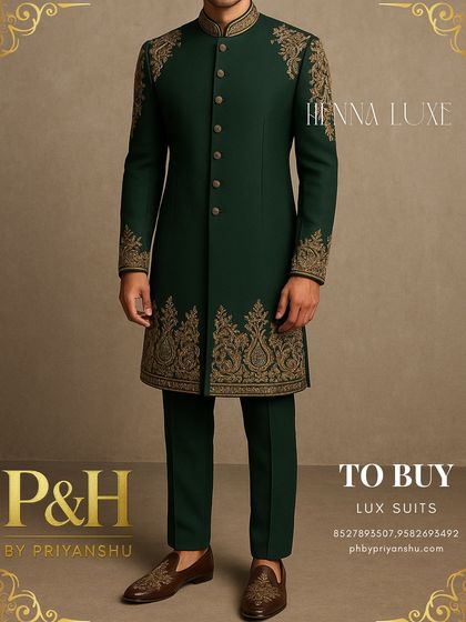 A three-quarter view of the green suit, highlighting the artistry of the hand-embroidery.