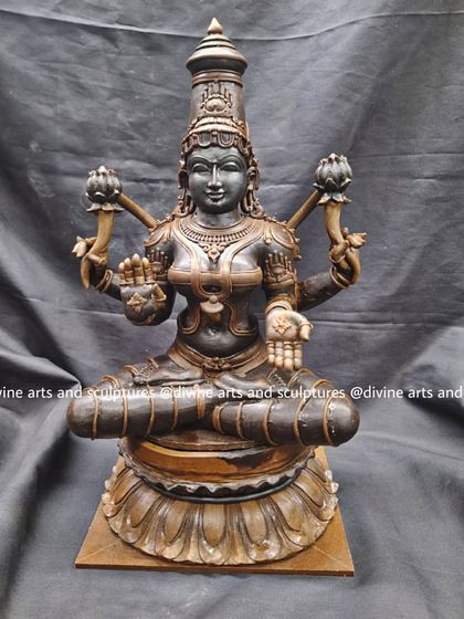 This wax model of Mahalakshmi is prepared for casting. The dark, smooth surface of the wax allows for incredible detail, which will be perfectly replicated in the final bronze statue.