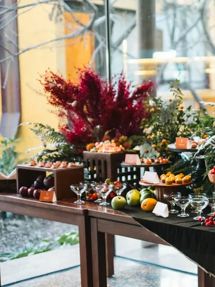 A wide shot of our grand grazing table, showing the sheer abundance and variety of the spread. From fresh fruits to intricate desserts, it is designed to impress.