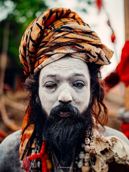 A striking portrait of an Aghori sadhu in Varanasi, his face marked by ash and his eyes telling a thousand stories. This is a glimpse into the mystical side of the city.
