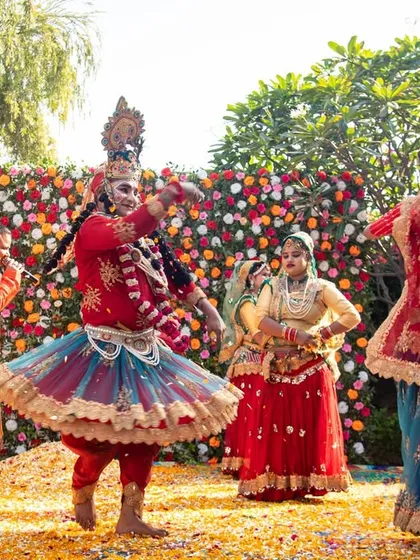 Traditional dancers performing at a Holi event, adding a cultural and artistic element to the celebration.