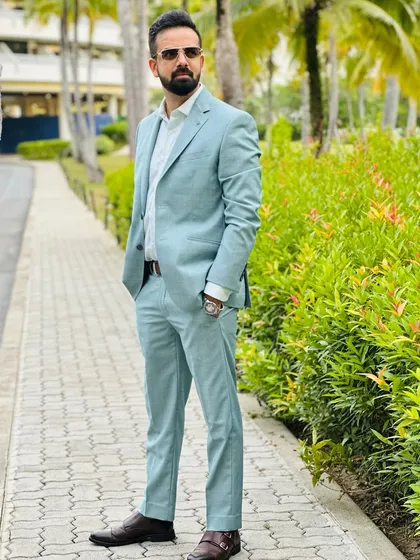 Another angle of the pastel suit against the lush greenery of Phuket. Style is all about the details.