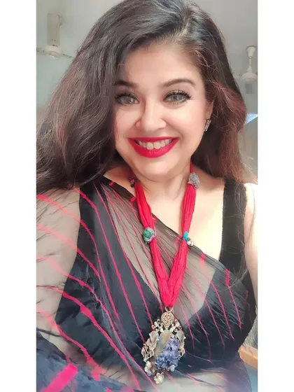 A happy selfie in my affordable leheriya saree. The vibrant red and black stripes are so eye-catching, and it proves that you can find incredible style at an amazing price in my store.