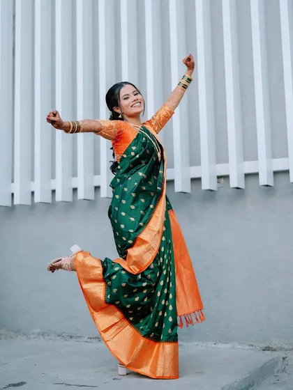 A joyful, celebratory jump from the bride, capturing the excitement of her engagement day.
