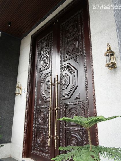 A full view of the completed entrance, where my Raga door pulls are paired with matching brass lanterns. This demonstrates how I can create a suite of hardware to ensure a consistent design language across all exterior elements for a truly polished look.