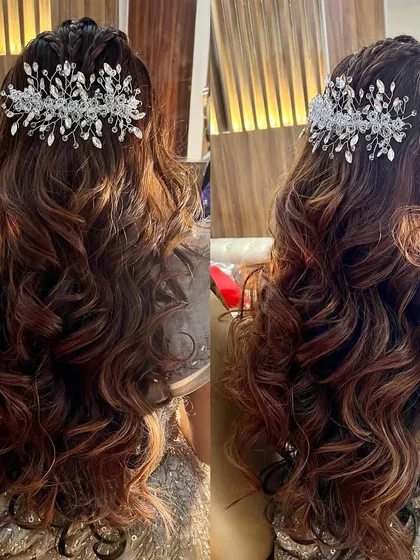 A detailed image of the curly half-up style, showing the placement of the accessory and the texture of the curls.
