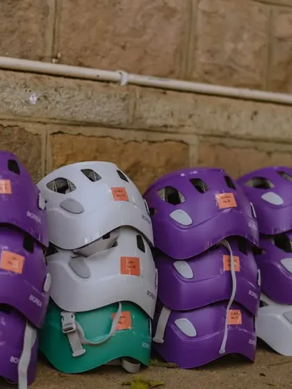 Our colorful collection of helmets, ready for an event. We provide all the necessary safety equipment for our roped climbing sessions.