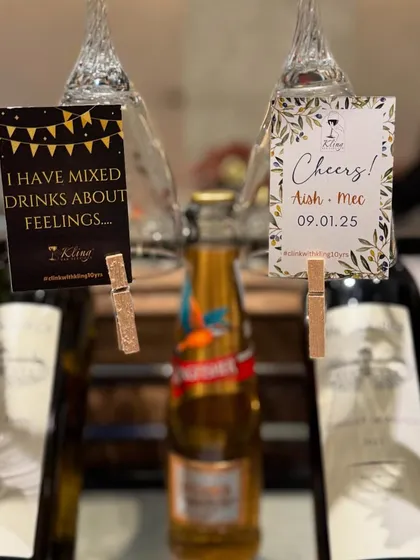 A special setup for Aish & Mec's anniversary, featuring personalized tags and a selection of fine wines.