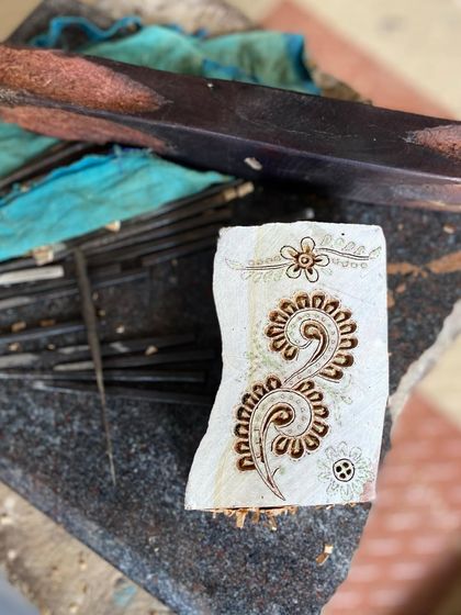 A close-up of a freshly carved block, ready for its first print. The crisp lines and intricate details showcase the precision and artistry that go into every single one of our custom and heritage designs.