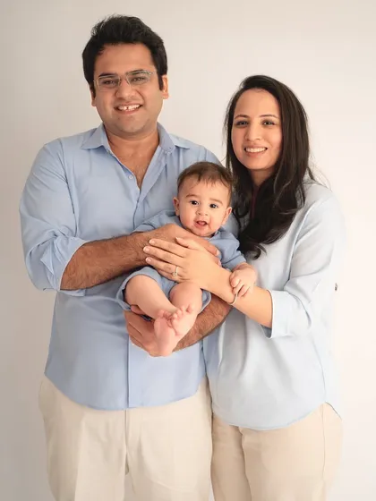 A classic family portrait, with everyone smiling at the camera. It's important to have these timeless shots to look back on for years to come.