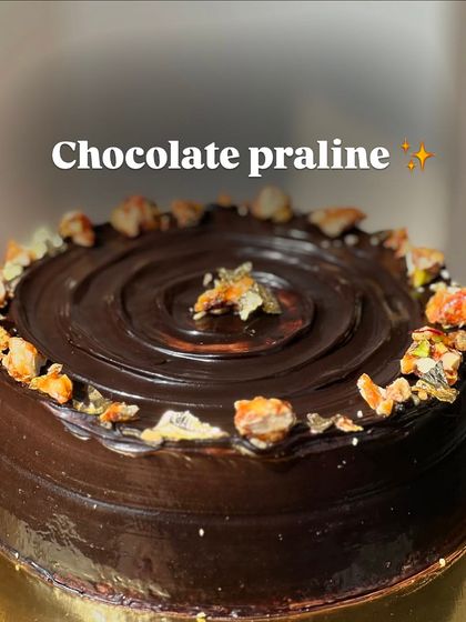 A rich and decadent Chocolate Praline cake. The crunchy praline pieces add a wonderful texture to the smooth, dark chocolate ganache.