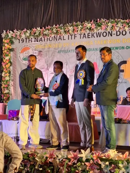 I am being felicitated at the 19th National Taekwon-Do ITF Championship in Rourkela. It is an honor to be recognized by the national federation for our academy's contribution.