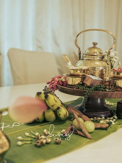 A closer view of the brass tea set and traditional elements on a dining table, creating an elegant and cultural centerpiece.