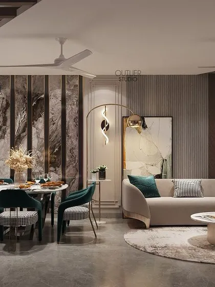 Meals and memories are made here. This dining room is magnificent in every sense, with elegant teal chairs, a modern art piece, and sculptural wall sconces that create a beautiful and inviting atmosphere.