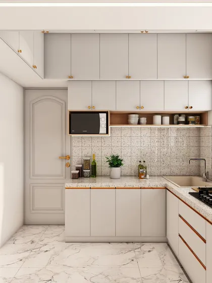 The design includes a dedicated niche for the microwave, keeping the countertop free for food preparation.
