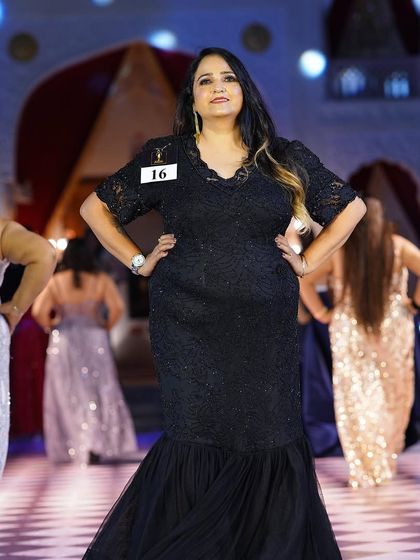 A plus-size model walks the ramp in a black fish-cut gown from my collection at the Maven Ms Plus Size India event. This showcases the glamour and perfect fit of my evening wear.