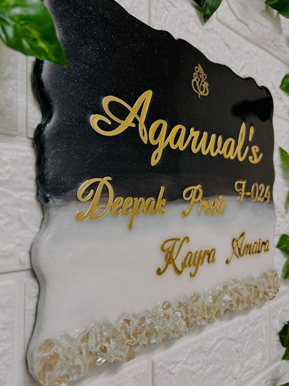 A side view of the geode nameplate, showing its unique, organic shape and the glossy finish of the resin.