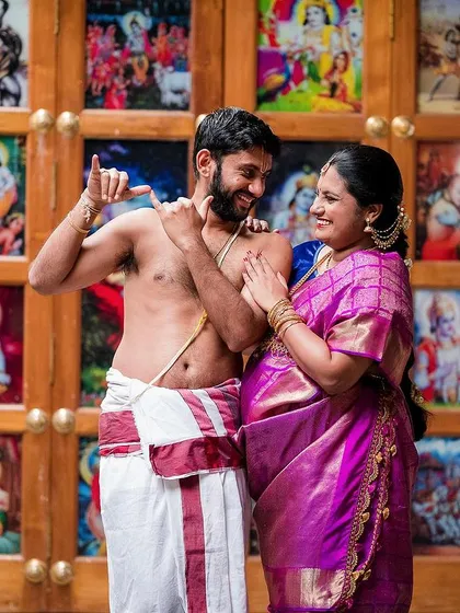 A playful moment during a maternity shoot at a temple, celebrating the couple's journey to parenthood. We focus on capturing the joy and connection between partners as they await their new arrival.