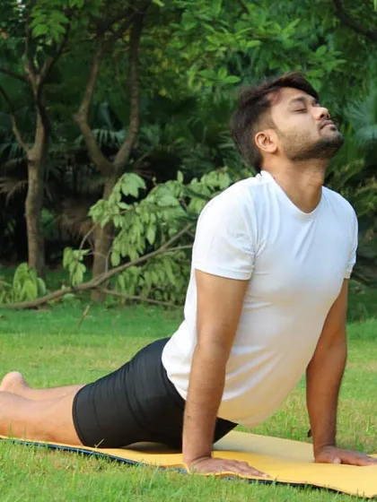 Bhujangasana (Cobra Pose) is a gentle, heart-opening backbend that increases spinal flexibility. It's a key part of the Sun Salutation sequence and feels wonderful for releasing tension in the upper back.