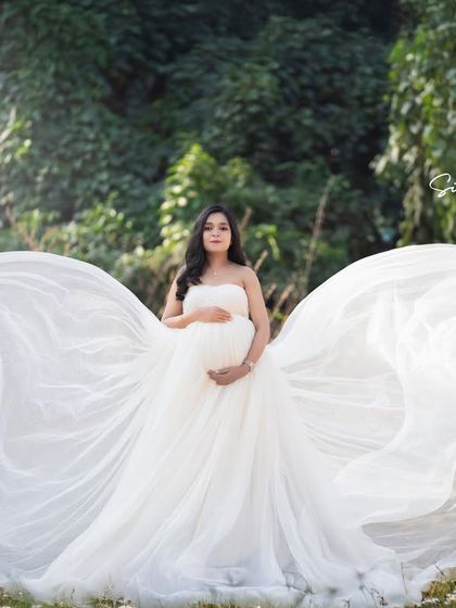 Another take on the "angel wings" concept, this wide shot captures the full, dramatic effect against the green backdrop.