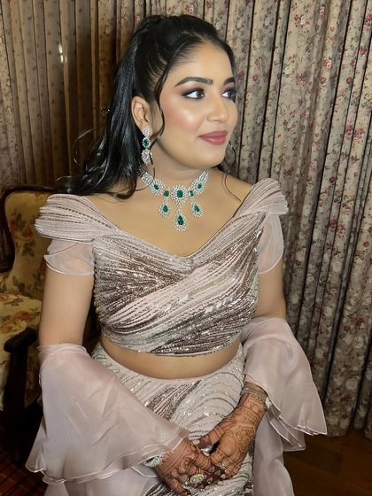 A close-up shot capturing the flawless skin and the subtle yet impactful eye makeup.