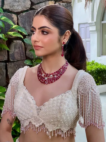 A closer look at my signature minimal soft bridal glam. The focus is on flawless skin, defined eyes with a subtle wing, and a neutral lip, paired with a modern ruby necklace.
