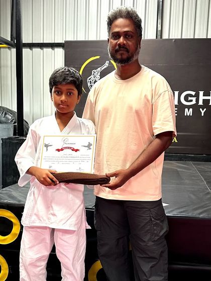 We are proud to present a student with his brown belt after a successful Karate Grading Exam. This represents his hard work and dedication.