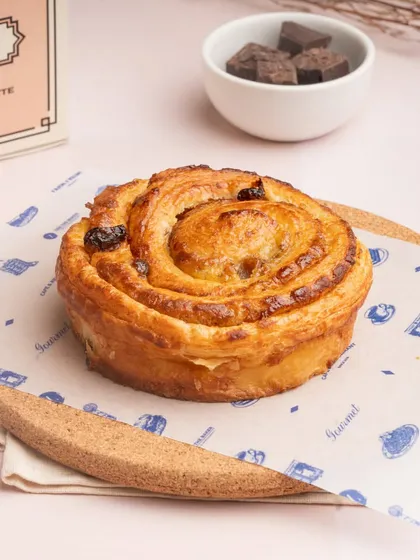 My Pain Aux Raisin is a classic French pastry. It's a spiral of croissant dough filled with pastry cream and sweet raisins, baked until golden.