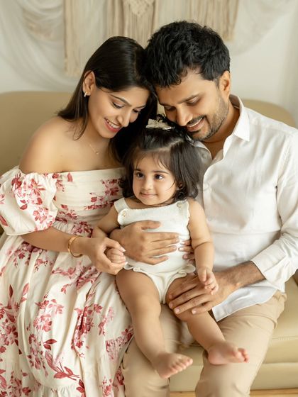 A picture-perfect family. This portrait captures the love and happiness of this beautiful family of three.