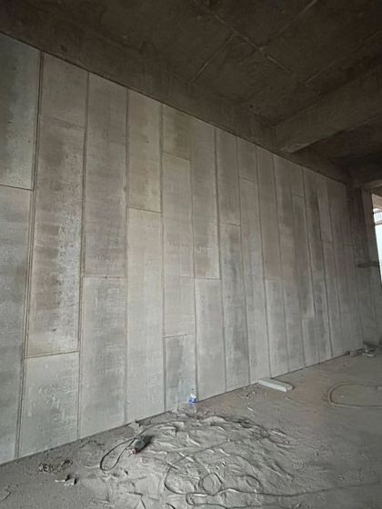 A completed partition wall made from Aerocon panels inside a building. This method is much faster and cleaner than traditional brick and mortar construction.