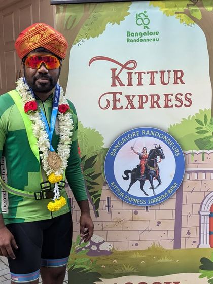 A finisher of the Kittur Express 1000K proudly displays his medal. This brevet is a true test, with a challenging 170km countryside detour and a tough, ascent-heavy return journey.