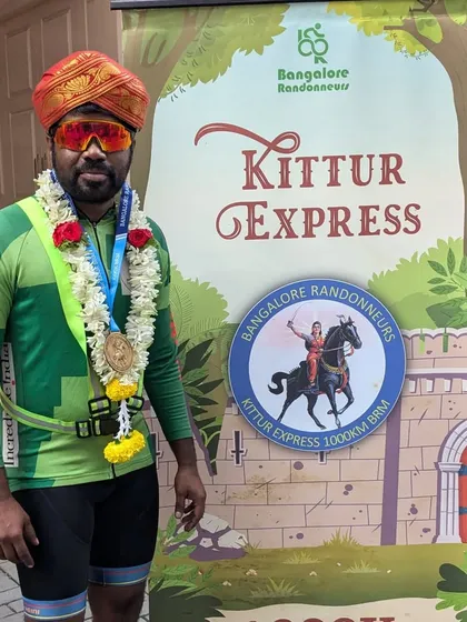 A finisher of the Kittur Express 1000K proudly displays his medal. This brevet is a true test, with a challenging 170km countryside detour and a tough, ascent-heavy return journey.