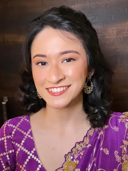 A beautiful portrait of my client with her dewy makeup look. The focus is on healthy, glowing skin with a touch of color on the cheeks and lips.