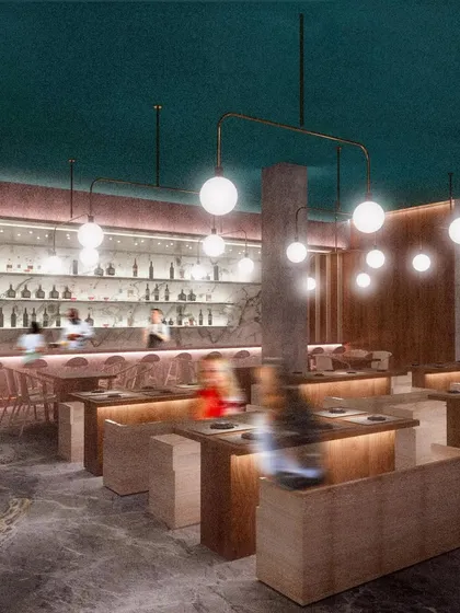 The main dining and bar area at CHAMPON. The design balances warm wood and cool stone with soft, ambient lighting to craft an atmosphere that is both sophisticated and serene, offering a calm escape from the city.