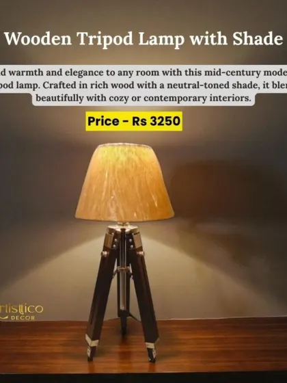 This wooden tripod lamp with a neutral-toned shade adds warmth and elegance to any room. It’s a mid-century modern piece that blends beautifully with cozy or contemporary interiors.