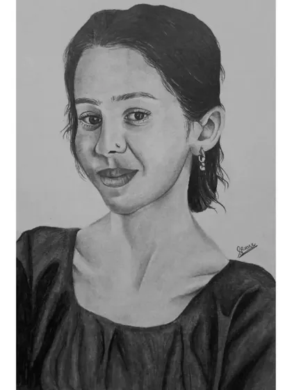 A finished A4 pencil sketch of a young woman with a gentle expression.