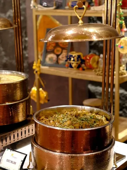 A main course buffet featuring our Subz Miloni in elegant copper chafing dishes, showcasing a setup fit for royalty.